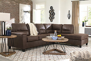 If you love the cool look of leather but long for the warm feel of fabric, you can take comfort in the McCammon sectional. Wrapped in a fabulous faux leather with a weathered hue and hint of pebbly texture to resemble the real deal, this decidedly modern sectional proves less is more. Elements include angled side profiling and track armrests wrapped with a layer of pillowy softness for that little something extra. Prominent jumbo stitching and clean-lined divided back styling lend fashion-forward flair.Includes 2 pieces: right-arm facing corner chaise and left-arm facing sofa | "Left-arm" and "right-arm" describe the position of the arm when you face the piece | Corner-blocked frame | High-resiliency foam cushions wrapped in thick poly fiber | Polyester and polyurethane (faux leather) upholstery  | Attached back and loose seat cushions | Exposed feet with faux wood finish | Platform foundation system resists sagging 3x better than spring system after 20,000 testing cycles by providing more even support | Smooth platform foundation maintains tight, wrinkle-free look without dips or sags that can occur over time with sinuous spring foundations | Estimated Assembly Time: 5 Minutes