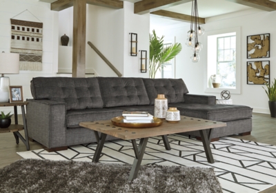 Bringing ultra-contemporary flair to the art of modern interiors, the Coulee Point sectional in charcoal gray velvet is so on point. Brilliantly simple box cushions and wide track arms are outlined with distinctive flange welting for a high-design aesthetic. Tufted cushions add to the sumptuous look and feel for an indulgent experience made to be comfortably affordable.Includes 2 pieces: right-arm facing corner chaise and left-arm facing sofa | "Left-arm" and "right-arm" describe the position of the arm when you face the piece | Corner-blocked frame | Loose cushions | High-resiliency foam cushions wrapped in thick poly fiber | Polyester velvet upholstery  | Exposed feet with faux wood finish | Platform foundation system resists sagging 3x better than spring system after 20,000 testing cycles by providing more even support | Smooth platform foundation maintains tight, wrinkle-free look without dips or sags that can occur over time with sinuous spring foundations | Estimated Assembly Time: 5 Minutes