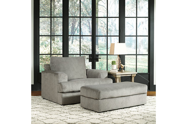 Flaunting a trendsetting silhouette, the Soletren oversized chair puts the contemporary in your contemporary home. Seating space is ample, giving you elongated plushness for deep relaxation. Microfiber fabric satisfies your need for a piece that feels as good as it looks.Corner-blocked frame | Attached back and loose seat cushions | High-resiliency foam cushions wrapped in thick poly fiber | Platform foundation system resists sagging 3x better than spring system after 20,000 testing cycles by providing more even support | Smooth platform foundation maintains tight, wrinkle-free look without dips or sags that can occur over time with sinuous spring foundations | Polyester upholstery | Exposed feet with faux wood finish