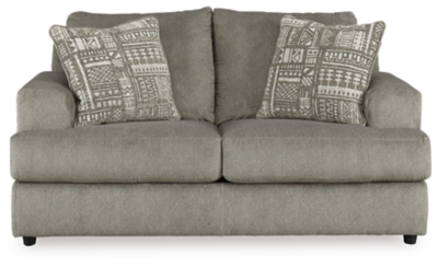 Flaunting a trendsetting silhouette, the Soletren loveseat puts the contemporary in your contemporary home. Its “three over two” profile eliminates the center seat cushion, giving you elongated plushness and deep seating. Microfiber fabric satisfies your need for a piece that feels as good as it looks. Accented with soft jacquard chenille throw pillows for a splash of geometric pattern and color contrast.Corner-blocked frame | Attached back and loose seat cushions | High-resiliency foam cushions wrapped in thick poly fiber | Platform foundation system resists sagging 3x better than spring system after 20,000 testing cycles by providing more even support | Smooth platform foundation maintains tight, wrinkle-free look without dips or sags that can occur over time with sinuous spring foundations | 2 decorative pillows included | Pillows with soft polyfill | Polyester upholstery and polyester pillows | Exposed feet with faux wood finish