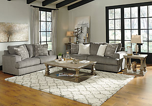 Flaunting a trendsetting silhouette, the Soletren sofa and loveseat put the contemporary in your contemporary home. Its “three over two” profile eliminates the center seat cushion, giving you elongated plushness and deep seating. Microfiber fabric satisfies your need for pieces that feel as good as they look. Accented with soft jacquard chenille throw pillows for a splash of geometric pattern and color contrast.Includes sofa and loveseat | Corner-blocked frame | Attached back and loose seat cushions | High-resiliency foam cushions wrapped in thick poly fiber | Toss pillows included | Pillows with soft polyfill | Polyester upholstery and polyester pillows | Exposed feet with faux wood finish | Sofa and loveseat with platform foundation system resists sagging 3x better than spring system after 20,000 testing cycles by providing more even support | Smooth platform foundation maintains tight, wrinkle-free look without dips or sags that can occur over time with sinuous spring foundations