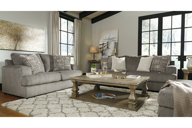 Flaunting a trendsetting silhouette, the Soletren loveseat puts the contemporary in your contemporary home. Its “three over two” profile eliminates the center seat cushion, giving you elongated plushness and deep seating. Microfiber fabric satisfies your need for a piece that feels as good as it looks. Accented with soft jacquard chenille throw pillows for a splash of geometric pattern and color contrast.Corner-blocked frame | Attached back and loose seat cushions | High-resiliency foam cushions wrapped in thick poly fiber | Platform foundation system resists sagging 3x better than spring system after 20,000 testing cycles by providing more even support | Smooth platform foundation maintains tight, wrinkle-free look without dips or sags that can occur over time with sinuous spring foundations | 2 decorative pillows included | Pillows with soft polyfill | Polyester upholstery and polyester pillows | Exposed feet with faux wood finish