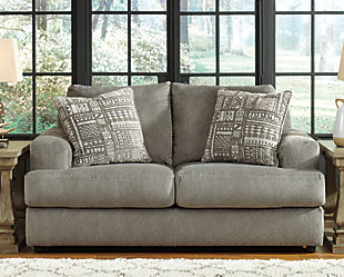 Flaunting a trendsetting silhouette, the Soletren loveseat puts the contemporary in your contemporary home. Its “three over two” profile eliminates the center seat cushion, giving you elongated plushness and deep seating. Microfiber fabric satisfies your need for a piece that feels as good as it looks. Accented with soft jacquard chenille throw pillows for a splash of geometric pattern and color contrast.Corner-blocked frame | Attached back and loose seat cushions | High-resiliency foam cushions wrapped in thick poly fiber | Platform foundation system resists sagging 3x better than spring system after 20,000 testing cycles by providing more even support | Smooth platform foundation maintains tight, wrinkle-free look without dips or sags that can occur over time with sinuous spring foundations | 2 decorative pillows included | Pillows with soft polyfill | Polyester upholstery and polyester pillows | Exposed feet with faux wood finish