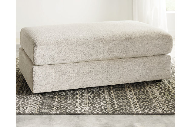 Flaunting a trendsetting silhouette, the Soletren oversized accent ottoman puts the contemporary in your contemporary home. Surface space is ample, giving you elongated plushness for foot relaxation. Chunky chenille fabric satisfies your need for a piece that feels as good as it looks.Corner-blocked frame | High-resiliency foam cushions wrapped in thick poly fiber | Polyester upholstery | Exposed feet with faux wood finish