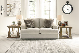 Flaunting a trendsetting silhouette, the Soletren loveseat puts the contemporary in your contemporary home. Its “three over two” profile eliminates the center seat cushion, giving you elongated plushness and deep seating. Chunky chenille fabric satisfies your need for a piece that feels as good as it looks. Accented with soft jacquard chenille throw pillows for a splash of geometric pattern and color contrast.Corner-blocked frame | Attached back and loose seat cushions | High-resiliency foam cushions wrapped in thick poly fiber | Platform foundation system resists sagging 3x better than spring system after 20,000 testing cycles by providing more even support | Smooth platform foundation maintains tight, wrinkle-free look without dips or sags that can occur over time with sinuous spring foundations | 2 decorative pillows included | Pillows with soft polyfill | Polyester upholstery and polyester pillows | Exposed feet with faux wood finish