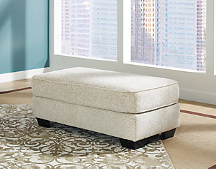 Firmly cushioned and generously scaled, the Monaghan ottoman provides a leg up on comfort and style. If you appreciate a touch of texture, you’re sure to love the ottoman’s chenille upholstery. Choice of sandstone beige is such a light and lovely style awakening.Corner-blocked frame | Firmly cushioned | High-resiliency foam cushion wrapped in thick poly fiber | Polyester upholstery | Exposed feet with faux wood finish