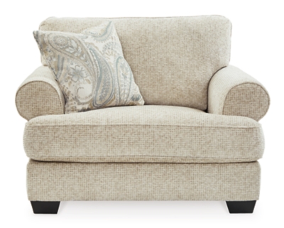 The Monaghan oversized chair strikes a beautiful balance between classic and current. Traditional elements include t-cushion seating and setback roll arms, angled for modern flair. Jacquard paisley pillow makes a muted, mellow complement to the chair’s casual textured chenille upholstery. Choice of sandstone beige is a light and lovely style awakening.Plush seating | Corner-blocked frame | Reversible cushions | High-resiliency foam cushions wrapped in thick poly fiber | Platform foundation system resists sagging 3x better than spring system after 20,000 testing cycles by providing more even support | Smooth platform foundation maintains tight, wrinkle-free look without dips or sags that can occur over time with sinuous spring foundations | Toss pillow included | Pillow with soft polyfill | Polyester upholstery; polyester and polyester/linen pillow | Exposed feet with faux wood finish