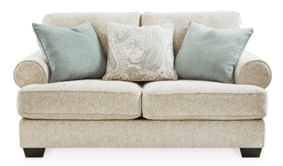 The Monaghan loveseat strikes a beautiful balance between classic and current. Traditional elements include t-cushion seating and setback roll arms, angled for modern flair. Posh collection of pillows in spa mist and jacquard paisley make a muted, mellow complement to the loveseat’s casual textured chenille upholstery. Choice of sandstone beige is a light and lovely style awakening.Plush seating | Corner-blocked frame | Reversible cushions | High-resiliency foam cushions wrapped in thick poly fiber | Platform foundation system resists sagging 3x better than spring system after 20,000 testing cycles by providing more even support | Smooth platform foundation maintains tight, wrinkle-free look without dips or sags that can occur over time with sinuous spring foundations | 3 toss pillows included | Pillows with soft polyfill | Polyester upholstery; polyester and polyester/linen pillows | Exposed feet with faux wood finish