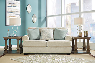The Monaghan loveseat strikes a beautiful balance between classic and current. Traditional elements include t-cushion seating and setback roll arms, angled for modern flair. Posh collection of pillows in spa mist and jacquard paisley make a muted, mellow complement to the loveseat’s casual textured chenille upholstery. Choice of sandstone beige is a light and lovely style awakening.Plush seating | Corner-blocked frame | Reversible cushions | High-resiliency foam cushions wrapped in thick poly fiber | Platform foundation system resists sagging 3x better than spring system after 20,000 testing cycles by providing more even support | Smooth platform foundation maintains tight, wrinkle-free look without dips or sags that can occur over time with sinuous spring foundations | 3 toss pillows included | Pillows with soft polyfill | Polyester upholstery; polyester and polyester/linen pillows | Exposed feet with faux wood finish