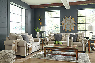 The Zarina sofa and loveseat let you make a high-style statement at a comfortably affordable price. Richly traditional roll arms are given a modern punch care of oversized nailhead trim in a black nickeltone finish. Linen-weave upholstery in fresh and clean sandstone beige is complemented designer pillows that add texture and sophistication.Includes sofa and loveseat | Corner-blocked frame | Attached back and loose seat cushions | Toss pillows included | Pillows with soft polyfill | Polyester upholstery; polyester and polyester/chenille pillows | Black nickeltone nailhead trim | Exposed feet with faux wood finish | High-resiliency foam cushions wrapped in thick poly fiber | Sofa and loveseat with platform foundation system resists sagging 3x better than spring system after 20,000 testing cycles by providing more even support | Smooth platform foundation maintains tight, wrinkle-free look without dips or sags that can occur over time with sinuous spring foundations