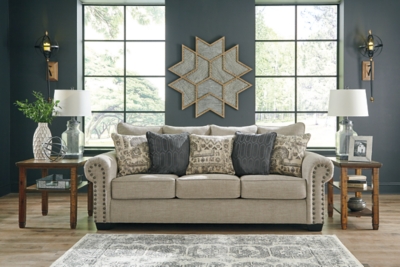 The Zarina sofa sleeper lets you make a high-style statement at a comfortably affordable price. Richly traditional roll arms are given a modern punch care of oversized nailhead trim in a black nickel-tone finish. Linen-weave upholstery in fresh and clean sandstone beige is complemented with designer pillows that add texture and sophistication. Pull-out queen mattress in quality memory foam comfortably accommodates overnight guests.Corner-blocked frame | Attached back and loose seat cushions | High-resiliency foam cushions wrapped in thick poly fiber | 5 toss pillows included | Pillows with soft polyfill | Polyester upholstery; polyester and polyester/chenille pillows | Black nickel-tone nailhead trim | Exposed feet with faux wood finish | Included bi-fold queen memory foam mattress sits atop a supportive steel frame | Memory foam provides better airflow for a cooler night’s sleep | Memory foam encased in damask ticking