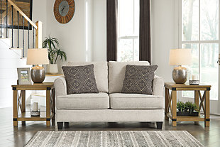 Whether you’re creating a warm and cozy modern farmhouse or cool and contemporary escape, the Alcona loveseat is sure to look right at home. High armrests with a rounded track design provide a chic, sheltering effect. Light linen-tone upholstery is a beauty to behold.Corner-blocked frame | Attached back and reversible seat cushions | High-resiliency foam cushions wrapped in thick poly fiber | Platform foundation system resists sagging 3x better than spring system after 20,000 testing cycles by providing more even support | Smooth platform foundation maintains tight, wrinkle-free look without dips or sags that can occur over time with sinuous spring foundations | 2 toss pillows included | Pillows with soft polyfill | Polyester upholstery and pillows | Exposed feet with faux wood finish