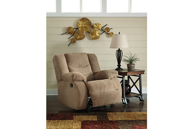 The Tulen rocker recliner puts the win in winning. Its waterfall back design and doubly plump pillow top arms team up with soft chenille fabric to go for the goal. Ample seating room makes the comfort possibilities endless. Sit back and relax. You won’t go wrong with this recliner.Gentle rocking motion | Pull tab reclining motion | Corner-blocked frame with metal reinforced seat | High-resiliency foam cushion wrapped in thick poly fiber | Polyester upholstery | Excluded from promotional discounts and coupons