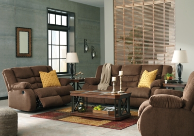 The Tulen reclining sofa puts the win in winning. Its waterfall back design and doubly plump pillow top arms team up with soft chenille fabric to go for the goal. Ample seating room makes the comfort possibilities endless. Sit back and relax. You won’t go wrong with this reclining loveseat.Dual-sided recliner; middle seat remains stationary | Pull tab reclining motion | Corner-blocked frame with metal reinforced seat | High-resiliency foam cushion wrapped in thick poly fiber | Polyester upholstery