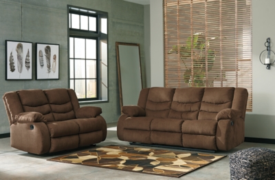 The Tulen reclining sofa puts the win in winning. Its waterfall back design and doubly plump pillow top arms team up with soft chenille fabric to go for the goal. Ample seating room makes the comfort possibilities endless. Sit back and relax. You won’t go wrong with this reclining loveseat.Dual-sided recliner; middle seat remains stationary | Pull tab reclining motion | Corner-blocked frame with metal reinforced seat | High-resiliency foam cushion wrapped in thick poly fiber | Polyester upholstery