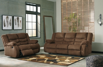 The Tulen reclining sofa puts the win in winning. Its waterfall back design and doubly plump pillow top arms team up with soft chenille fabric to go for the goal. Ample seating room makes the comfort possibilities endless. Sit back and relax. You won’t go wrong with this reclining loveseat.Dual-sided recliner; middle seat remains stationary | Pull tab reclining motion | Corner-blocked frame with metal reinforced seat | High-resiliency foam cushion wrapped in thick poly fiber | Polyester upholstery