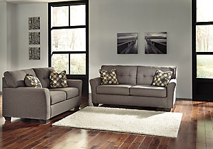 Inspired by high-end menswear, the Tibbee sofa and loveseat set is tailored to perfection and dressed to impress. Button-less tufting on the back cushions is richly subtle. Sleek, flared armrests enhance the clean-lined, striking profile.Includes sofa and loveseat | Corner-blocked frame | Attached back and loose seat cushions | High-resiliency foam cushions wrapped in thick poly fiber | Accent pillows included | Pillows with soft polyfill | Polyester upholstery and pillows | Exposed feet with faux wood finish
