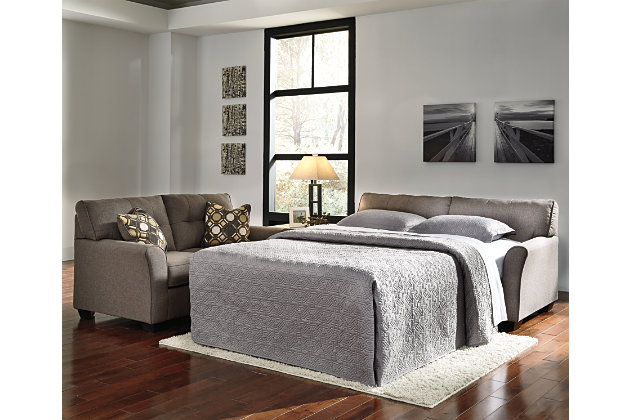 Inspired by high-end menswear, the Tibbee full sofa sleeper is tailored to perfection and dressed to impress. Button-less tufting on the back cushions is richly subtle. Sleek, flared armrests enhance Tibbee’s clean-lined, simply striking profile. Pull-out full mattress accommodates overnight guests.Corner-blocked frame | Attached back and loose seat cushions | High-resiliency foam cushions wrapped in thick poly fiber | 2 toss pillows included | Pillows with soft polyfill | Polyester upholstery and pillows | Exposed feet with faux wood finish | Included bi-fold full memory foam mattress sits atop a supportive metal frame