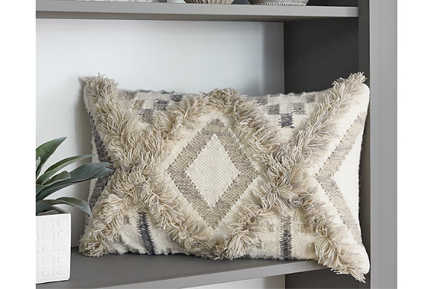 A natural treat for the eyes and the hands. The Liviah throw pillow brings a global appeal to your home. Diamond design in neutral tones is abounding with various textures. Perfect for the bohemian abode.Wool/cotton blend face with cotton reverse | Soft polyfill | Zipper closure | Dry clean only | Imported