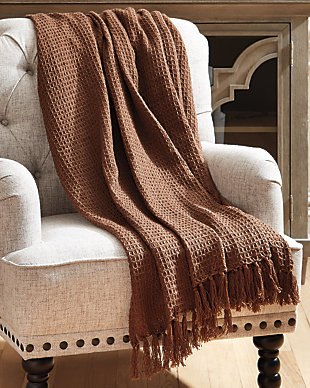 Designed using richly textured fabric and tassel edges, the Rowena throw is sure to be a go-to decor essential. Add a touch of warm to your space by draping over a chair or sofa.Made of polyester | Imported | Spot clean only