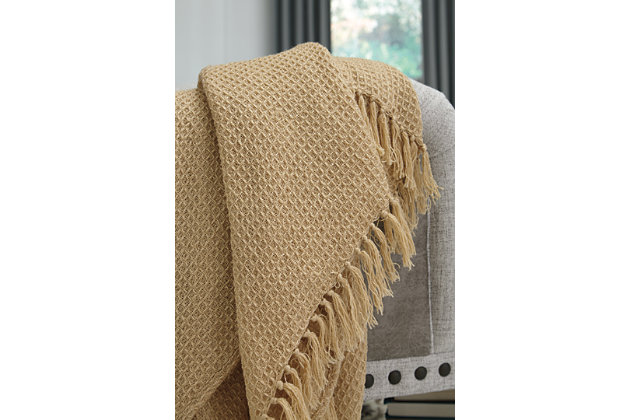 Designed using richly textured fabric and tassel edges, the Rowena throw is sure to be a go-to decor essential. Add a touch of warm to your space by draping over a chair or sofa.Polyester | Spot clean only | Imported