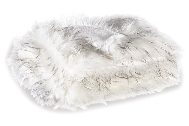 Who wouldn’t go wild for the Calisa faux fur throw? Its white faux fur takes on a whole new level with brushed black tipping. The look is so sophisticated and the feel…truly indulgent.Acrylic/polyester | Imported | Dry clean only
