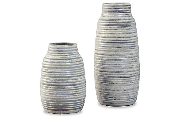 Artisan quality comes to life with crackle glazed ceramic and soft shapes of the Donaver duo vase set. Gray and white pops on the ribbed texturing for added appeal.Set of 2 | Made of ceramic | Crackle glazed finish | Imported | Clean with a soft, dry cloth