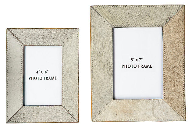 Lovers of clean, contemporary style go wild for the uniquely chic Odeda photo frames. Choice of hair on hide leather is cool and unexpected.Made of hair on hide and glass | Clean with a soft, dry cloth