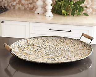 Heirloom-quality elegance that’s sized to make a statement. Didina tray’s embossed metal design is brought to life with the addition of a weathered goldtone finish. Top with carefully curated accent pieces or put on full display by propping against a wall.Made of metal with antiqued goldtone finish | Wood handles | Clean with a soft, dry cloth