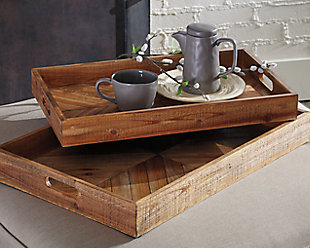 Splendidly farmhouse rustic, the Dewitt serving trays are full of woody style. Brown color gradation and chevron design bring interest to the interior. Integrated handles make for an easy serving experience.Includes 2 trays | Made of wood | Clean with a soft, dry cloth
