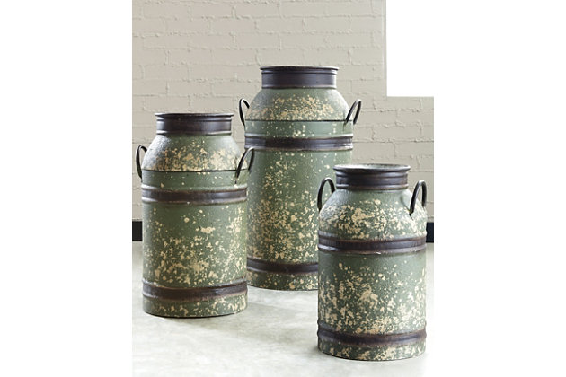 Yesteryear's goods are revived with modern-day appeal in the Elke 3-piece milk can set. Antiqued brown and green finished metal adds a beautiful nostalgic element. Trio accentuates farmhouse decor.Includes 3 milk cans | Made of metal | Antiqued brown and green finish | Clean with a soft, dry cloth