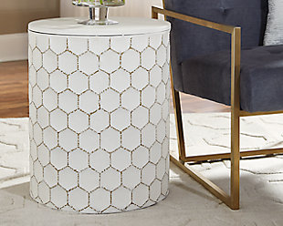 Trendsetting and contemporary. Take a fashion risk with the Polly accent stool. Outlined honeycomb design on hammered metal is teeming with texture. Decor on the solid top completes the look with style.Made of white finished metal | Excluded from promotional discounts and coupons