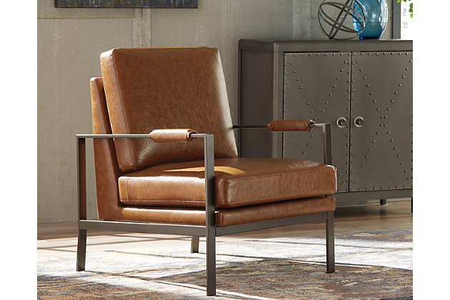 Find the perfect balance of high style and plush comfort with the Peacemaker accent chair. Ultra-linear metal frame and box seat cushion styling are sure to appeal to contemporary tastes. Weathered faux leather in a light brown tone give this cool chair a sense of warmth.Exposed metal frame in antique brass finish | Faux leather upholstery | Upholstery-wrapped padded armrests | Estimated Assembly Time: 30 Minutes