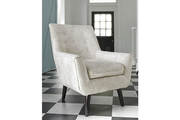 The Zossen accent chair proves that trends always come back around. Its sleek profile brings mid-century design back in style. Soft crushed velvet fabric in ivory is an upscale touch. Button tufting on the back makes this a dapper addition to your home.Attached back and loose seat cushions | Crushed velvet polyester upholstery | Exposed feet with faux wood finish | Excluded from promotional discounts and coupons | Estimated Assembly Time: 15 Minutes