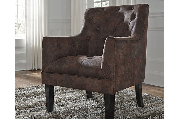 Drakelle accent chair with fashion-forward high leg silhouette gives a new meaning to traditional. Diamond button tufting garnishes the back and the plump seat. Distressed fabric with the look of quality leather adds a classic touch that you can appreciate. Mahogany brown color makes it all the more timeless.Attached back and seat cushions | High-resiliency foam cushions wrapped in thick poly fiber | Polyester upholstery | Exposed feet with faux wood finish | Excluded from promotional discounts and coupons | Estimated Assembly Time: 15 Minutes