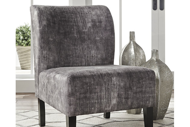 Fashion-forward Triptis accent chair adds a cool vibe to your home. Armless design is perfect for small spaces that need a spark of color. Charcoal gray hue with distressed finish saturates the ultra soft fabric. Supportive cushions bring in an element of comfort.Attached back and seat cushions | High-resiliency foam cushions wrapped in thick poly fiber | Polyester upholstery | Exposed feet with faux wood finish | Excluded from promotional discounts and coupons | Estimated Assembly Time: 15 Minutes