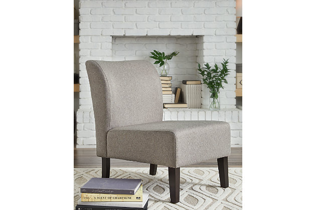 The fashion-forward Triptis accent chair adds a cool vibe to your home. Armless design is perfect for living spaces that need a spark of excitement. Bringing just enough pizazz to liven a space in a fresh, contemporary way, this accent chair is an especially smart choice for small spaces.Attached back and seat cushions | Light beige polyester upholstery | Wood legs in black finish | Assembly required | Estimated Assembly Time: 15 Minutes