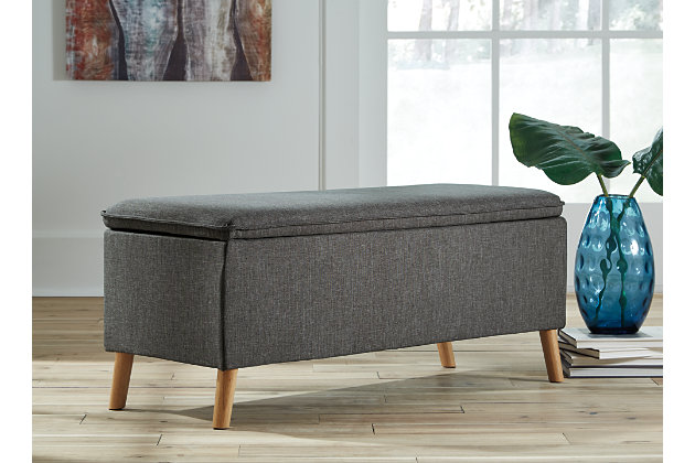The Kaviton bench makes a great piece for small spaces needing a bit of extra sitting space. Neutral gray fabric and natural wood finish legs fit right in with mix and match decor. Pillow top design makes the seat cushion all the more comfortable to sit on. Stack up greenery and planters nearby to watch bohemian style come to life.Made of wood | Polyester upholstery | Foam cushioned seat | Exposed legs in faux wood finish | Estimated Assembly Time: 15 Minutes