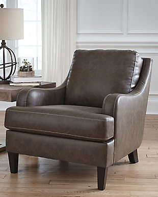 Turning heads with its unique blend of smooth lines and ruggedly handsome looks, the Tirolo accent chair invites you to take a seat. High-quality faux leather upholstery is comfortably practical and affordable. Details including gently sloped arms accentuated by jumbo stitching incorporate a handsome punch of character.Attached back and loose seat cushions | High-resiliency foam cushions wrapped in thick poly fiber | Polyurethane/polyester/cotton upholstery | Exposed feet with faux wood finish | Estimated Assembly Time: 15 Minutes