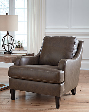 Turning heads with its unique blend of smooth lines and ruggedly handsome looks, the Tirolo accent chair invites you to take a seat. High-quality faux leather upholstery is comfortably practical and affordable. Details including gently sloped arms accentuated by jumbo stitching incorporate a handsome punch of character.Attached back and loose seat cushions | High-resiliency foam cushions wrapped in thick poly fiber | Polyurethane/polyester/cotton upholstery | Exposed feet with faux wood finish | Estimated Assembly Time: 15 Minutes