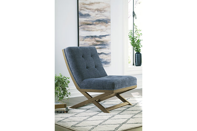 Take a comfy seat in the fashionable Sidewinder accent chair. Upholstered in a blue polyester blend fabric, you’ll love the way it feels. Tufted back adds a classy design element. Armless profile with “X” base makes it the perfect companion for open spaces.Attached back and seat cushions | Foam cushions are wrapped in thick poly fiber | Polyester blend upholstery | Exposed wood frame with light brown finish | Estimated Assembly Time: 30 Minutes