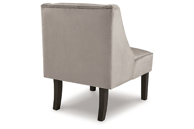 Warm and luxurious, but not without its own curves, the Janesley accent chair lends a quiet confidence to your room. The feel-good fabric and slope arm design set the tone for all proclaimed casually cool spaces.Taupe polyester velvet upholstery | Wood legs in black finish | Assembly required | Estimated Assembly Time: 30 Minutes