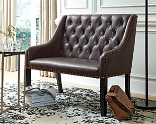 Today’s casual lifestyles call for updates to familiar profiles. The Carondelet settee is a refreshing take on traditional seating. Upholstered in a distressed faux leather with button-tufting and nailhead accents, this clean-lined bench is ready to supply extra seating in the dining room, den or entry.Distressed faux leather upholstery | Button-tufted back cushion | Brass-tone nailhead accents | Wood legs with a dark brown finish | Assembly required | Estimated Assembly Time: 30 Minutes