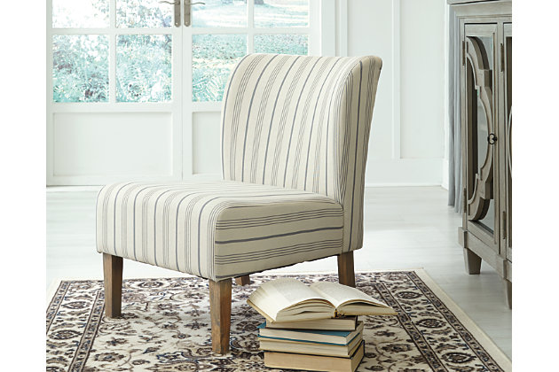 The Triptis slipper chair wows with elegant upholstery and sleek, linear design. Cool and casual, this chair is the perfect accent for the living room, dining room or bedroom. Gray-washed finish gives a fresh, vintage appeal.Attached back and seat cushions | Wood legs with gray-washed finish | Polyester/linen upholstery | Seat cushions with webbed construction | Assembly required | Estimated Assembly Time: 15 Minutes