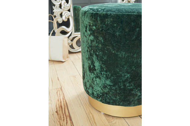 What a gem. The emerald green Lancer ottoman’s richly textured crushed velvet upholstery provides the glitz, while the goldtone metal base adds the glam. Use this precious prop as an accent table, ottoman or pouf, to suit the need.Polyester velvet upholstery | High-quality foam cushion | Metal base with goldtone finish