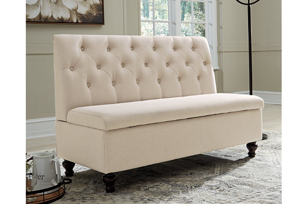 Finally, a storage option that’s a fabulous focal point. Whether gracing an entryway or adding a finishing touch to a family room, the Gwendale storage bench is sitting pretty. Armless styling is especially space efficient. Deep button tufting lends such a luxurious look.Beige polyester fabric | Foam cushioning | Button tufting | Wood legs in dark brown finish | Engineered wood bench interior | Hinged top with storage | Estimated Assembly Time: 30 Minutes