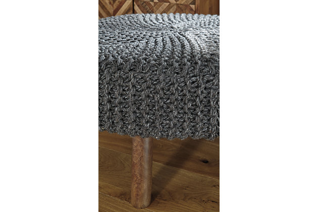 Round out your space in a casually cool way with the Jassmyn accent ottoman. Enticing with its hand-knitted charcoal yarn upholstery and canted wood legs, this oversized accent ottoman is sitting pretty.Made of polyester yarn | Hand-knitted | Charcoal gray | High-quality foam cushion | Wooden legs in brown finish | Estimated Assembly Time: 15 Minutes