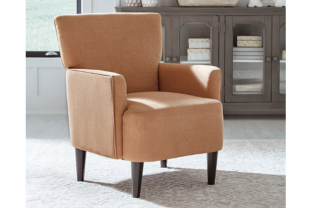 Tailor your space to your own tastes with the Hansridge accent chair. Track arms and a rust upholstery create a crisp impression. Exposed legs in a black finish add to the air of modernity.Made of polyester and wood | Polyester upholstery | Attached back and seat cushions | Exposed wood legs in black finish | Assembly required | Estimated Assembly Time: 30 Minutes