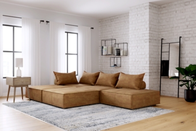 Deep, low seating says relax. Covered on all sides in a sleek and modern distressed faux leather with welted edges, the Bales accent chair set can be easily rearranged in infinite configurations. Thanks to its modular design, making the transformation from sectional to conversation pit is practically effortless.Includes 5 modular accent chairs | Distressed brown faux leather upholstery | 5 welted pillows and 5 bolsters with non-slip decking | Plastic non-slip feet in black finish | Minimal assembly required | Estimated Assembly Time: 75 Minutes