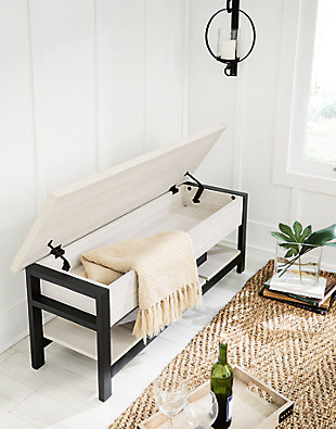 Seating with style and storage - what more could you need? This Rhyson storage bench has a hinged seat and plank shelf, making it the perfect multi-use piece. The white wood grain effect lends a casual touch, while the black finished legs and supports create a dynamic contrast.Engineered wood in white wood grained effect laminate | Solid wood legs and rail in black finish | Hinged seat with storage compartment | Plank shelf | Assembly required | Estimated Assembly Time: 60 Minutes
